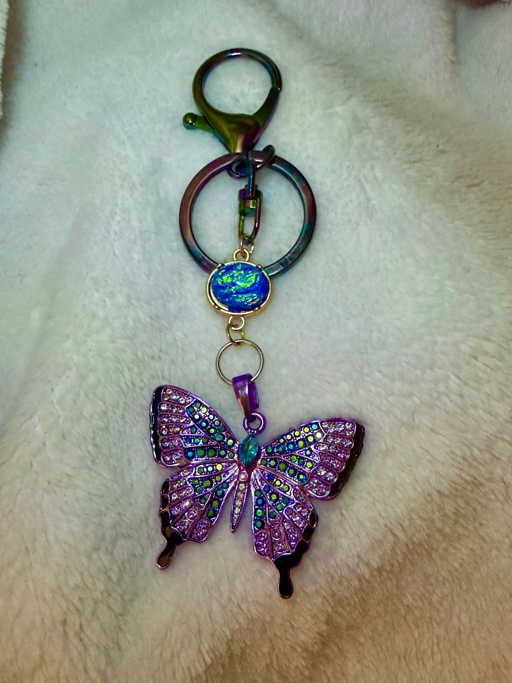 Blue and Purple Rhinestone Butterfly Keychain with iridescent blue accent bead and oil spill Clasp
