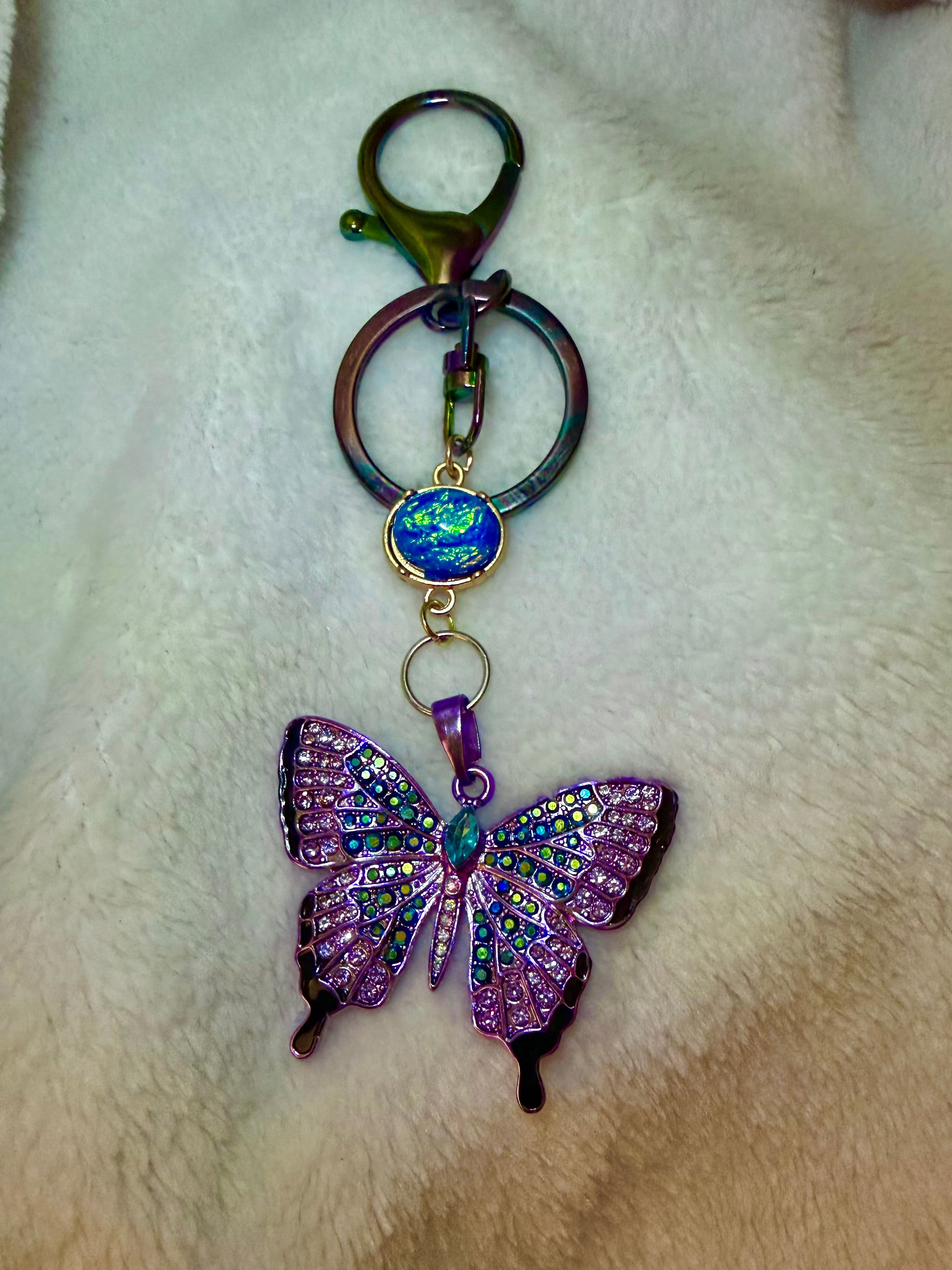 Blue and Purple Rhinestone Butterfly Keychain with iridescent blue accent bead and oil spill Clasp
