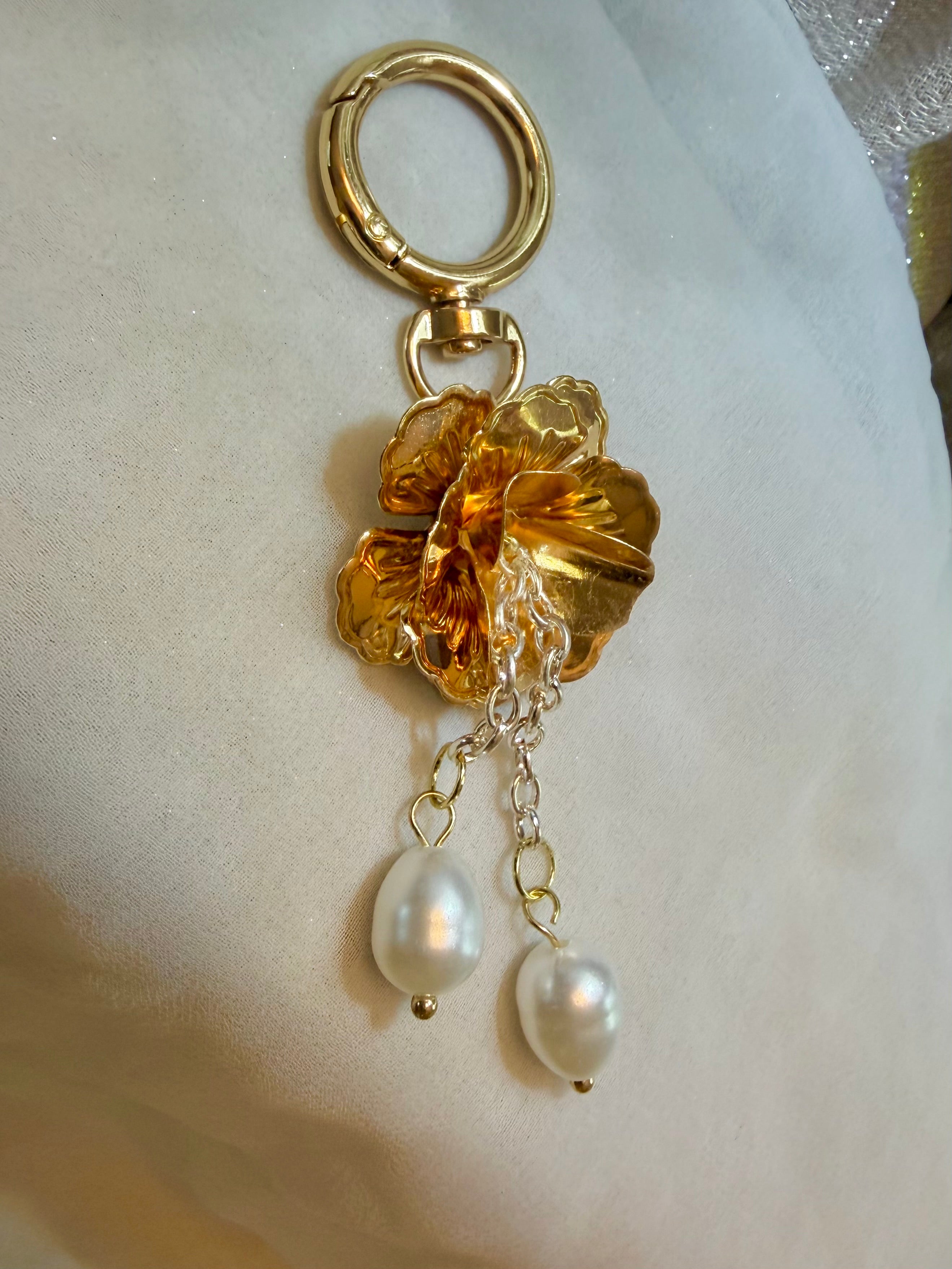 Brass tone petals with dangling drop pearls and ring clasp keychain