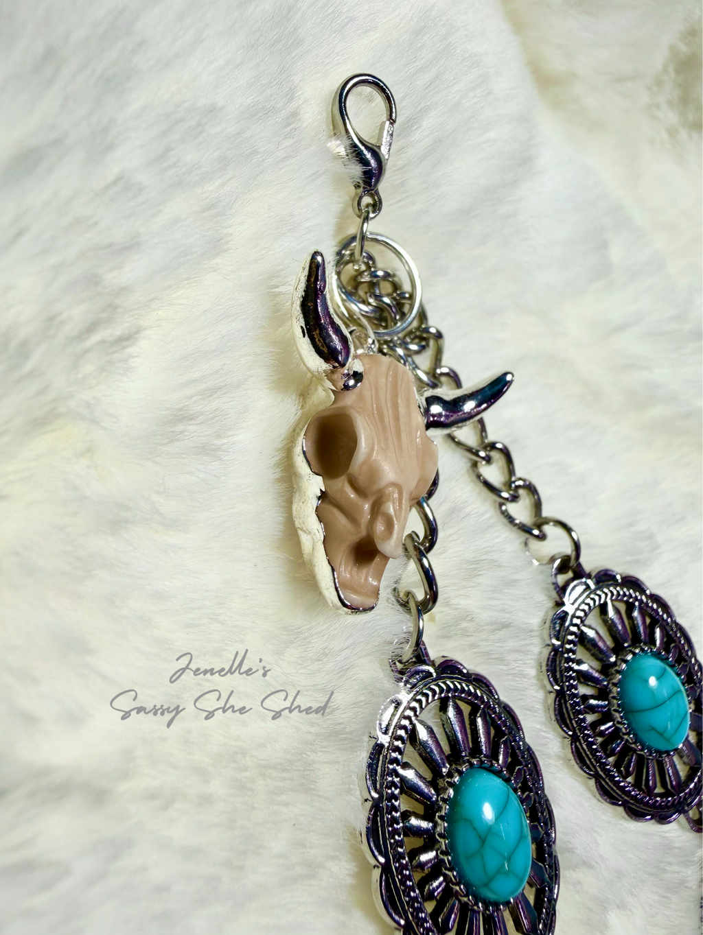Western turquoise and silver tone phone wristlet with desert skull accent charm