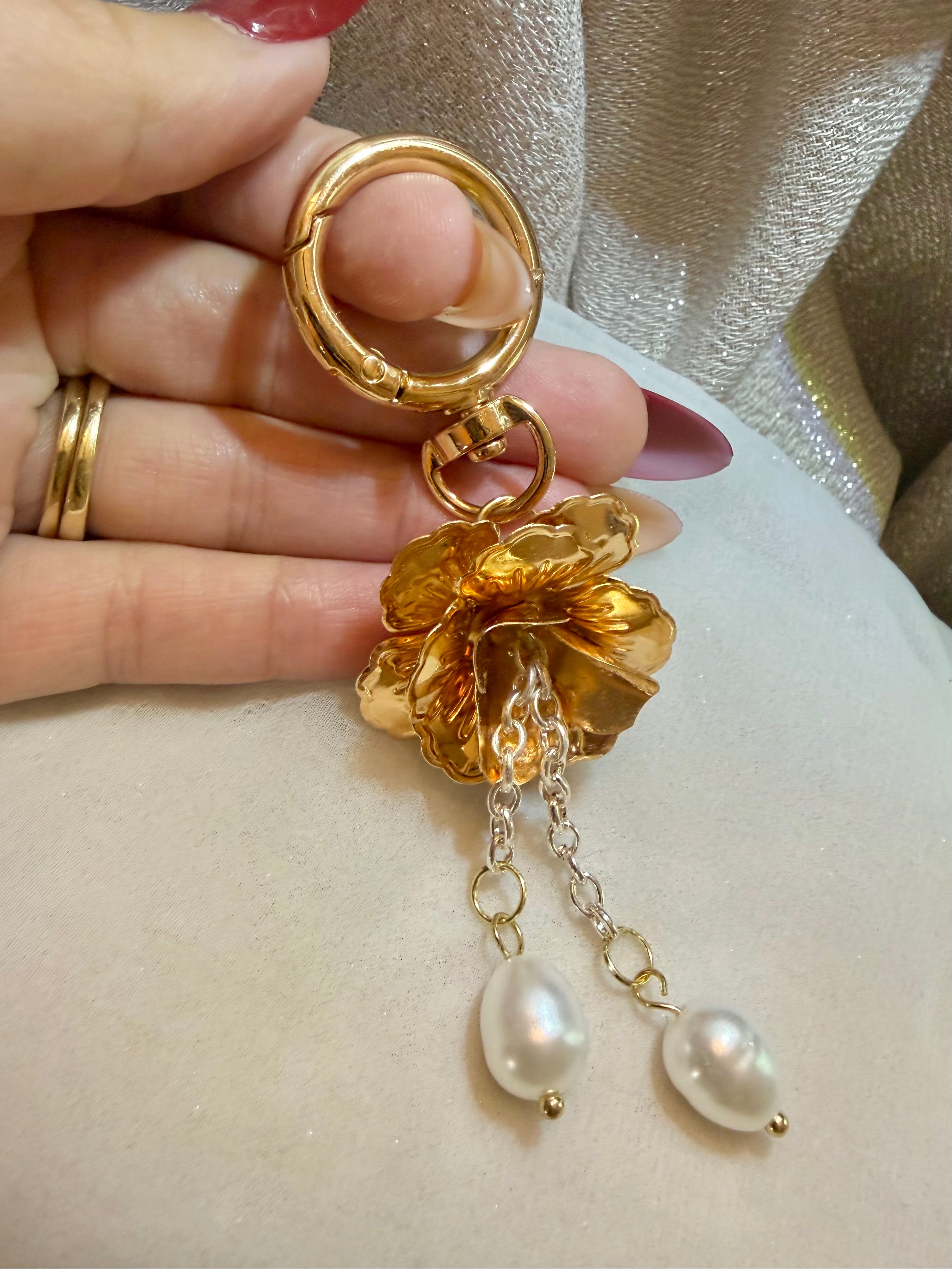 Brass tone petals with dangling drop pearls and ring clasp keychain