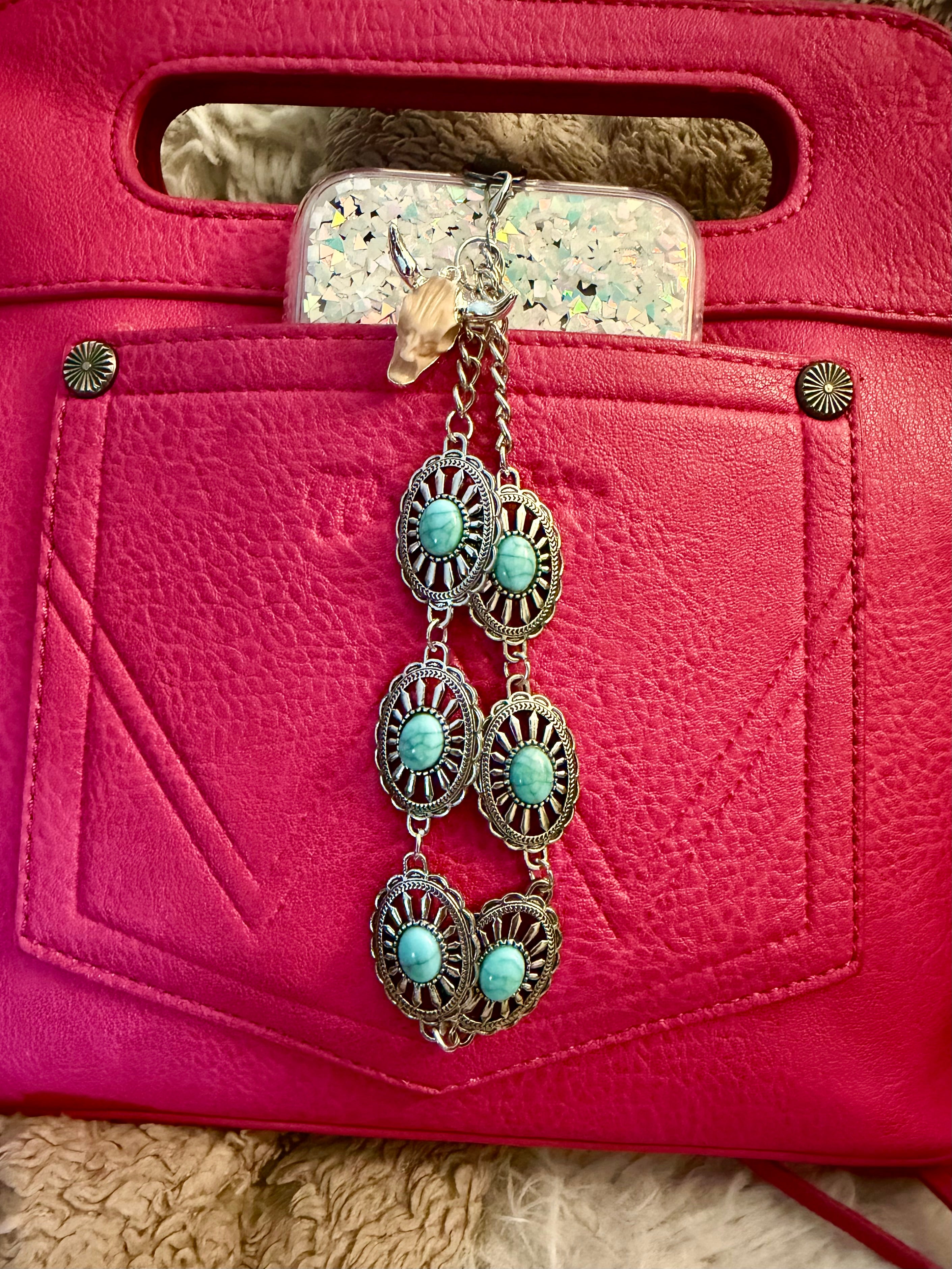 Western turquoise and silver tone phone wristlet with desert skull accent charm