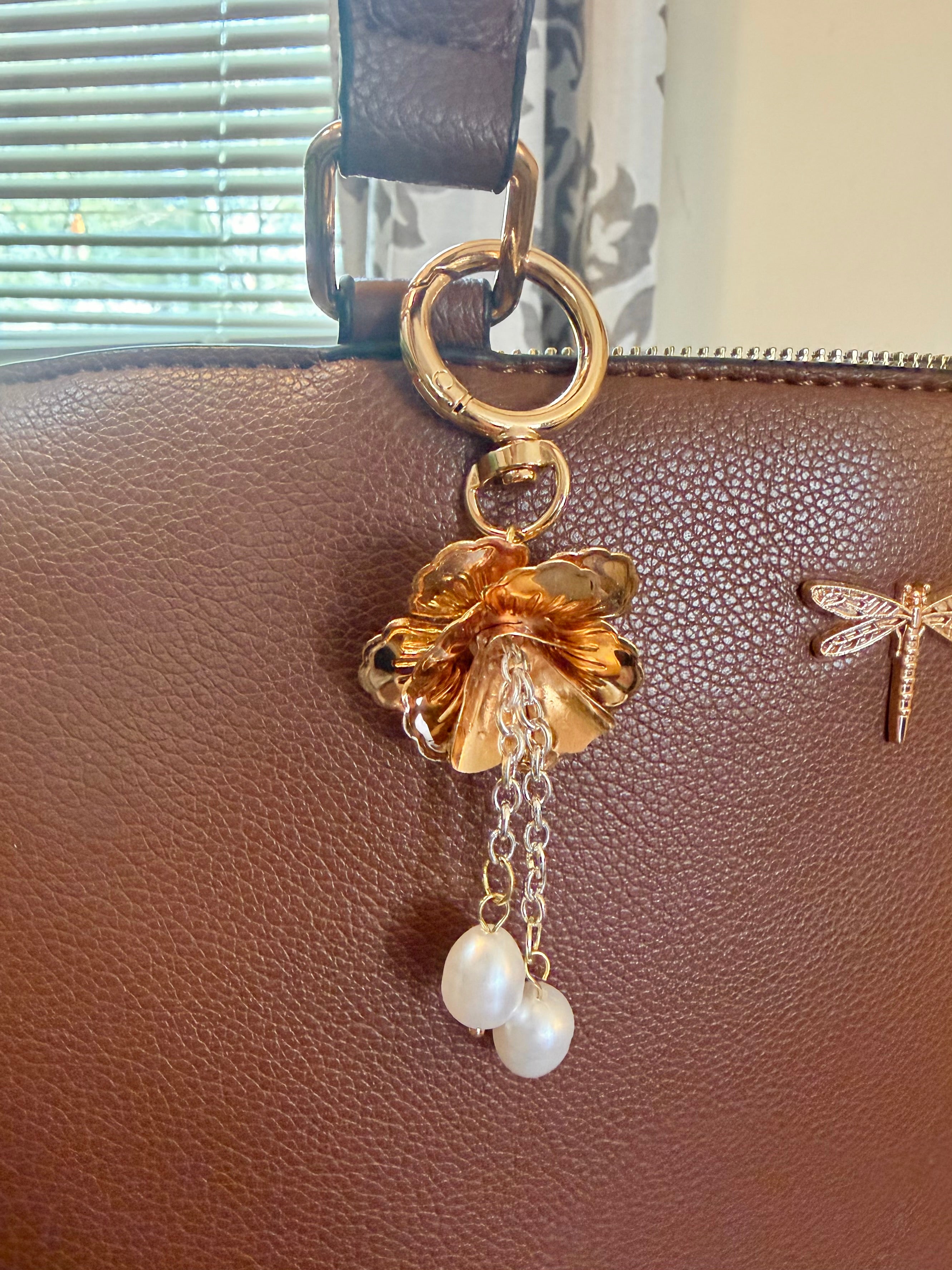 Brass tone petals with dangling drop pearls and ring clasp keychain