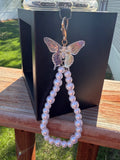 Pearl phone wristlet with ice crystal butterfly accent bead