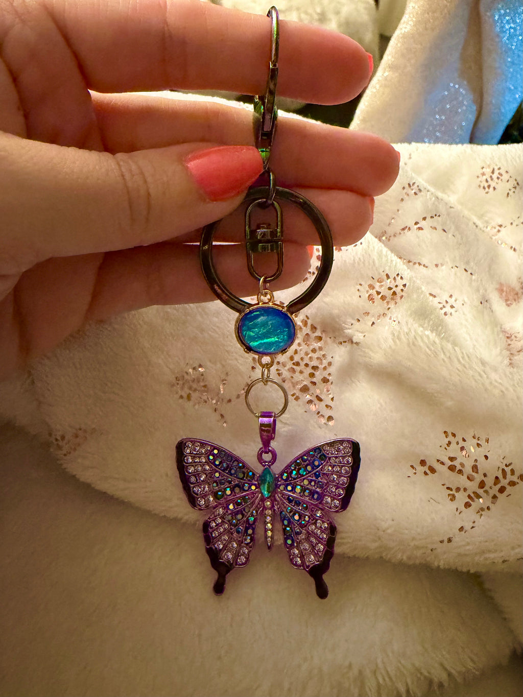 Blue and Purple Rhinestone Butterfly Keychain with iridescent blue accent bead and oil spill Clasp