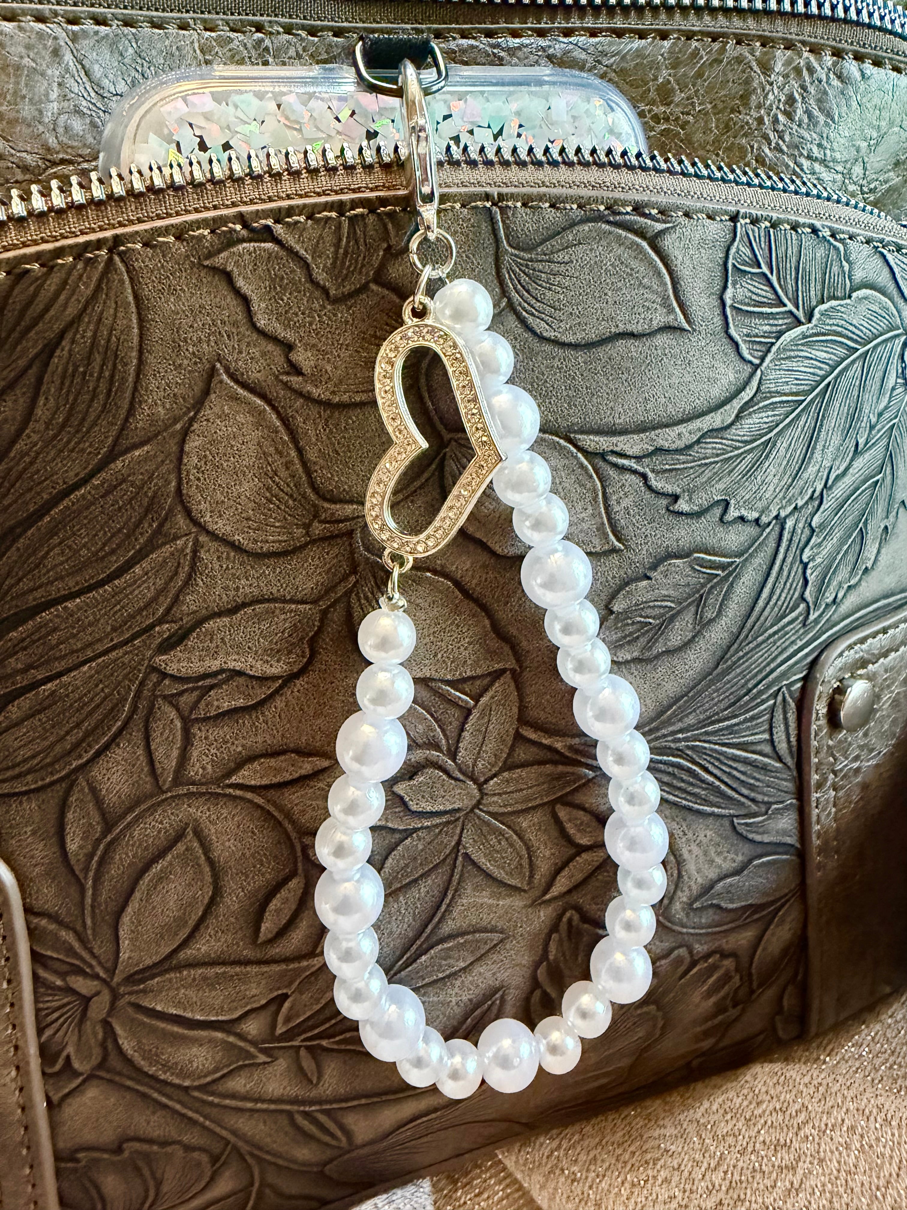 Pearl phone wristlet with rhinestone heart accent