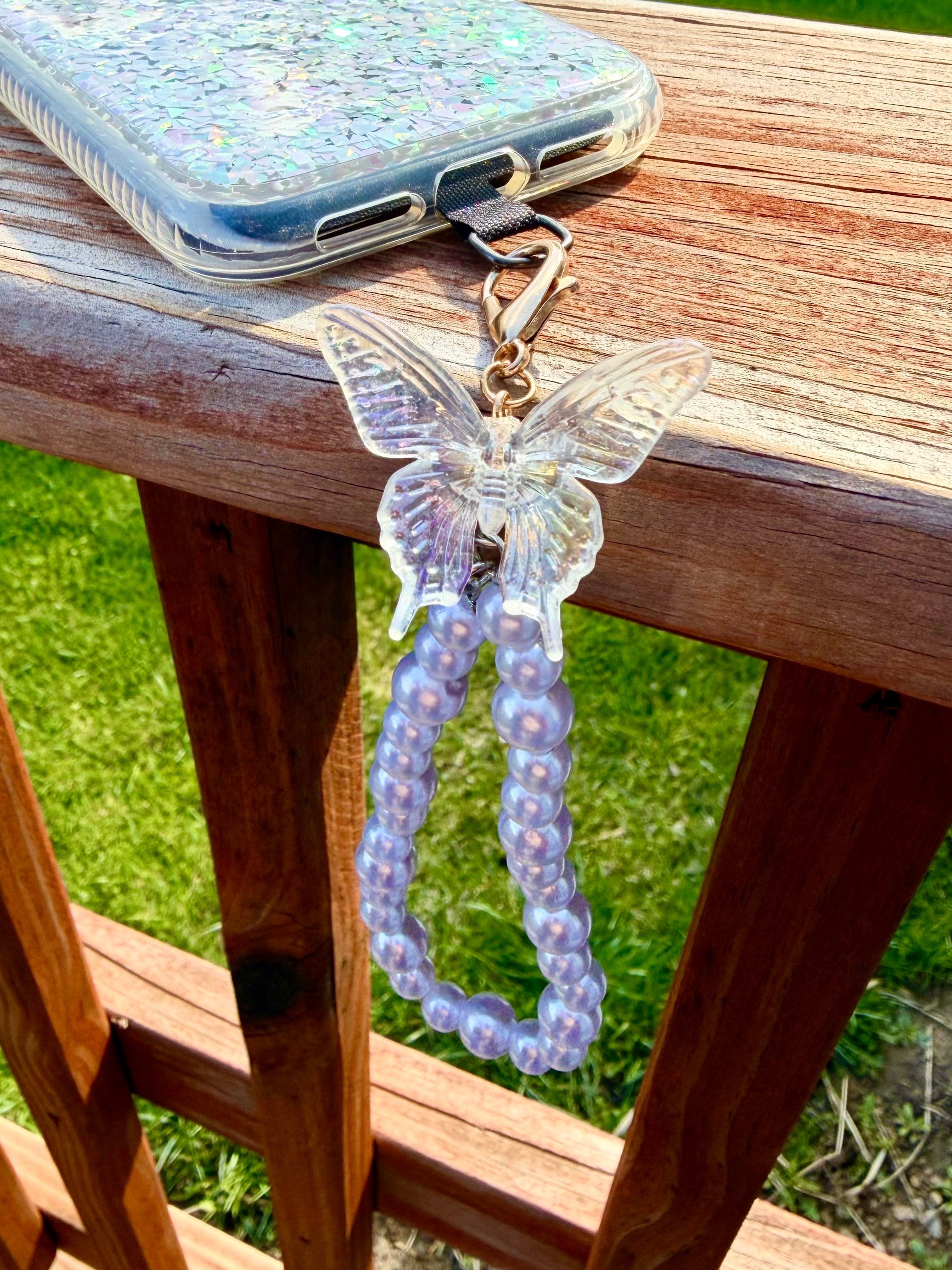 Pearl phone wristlet with ice crystal butterfly accent bead