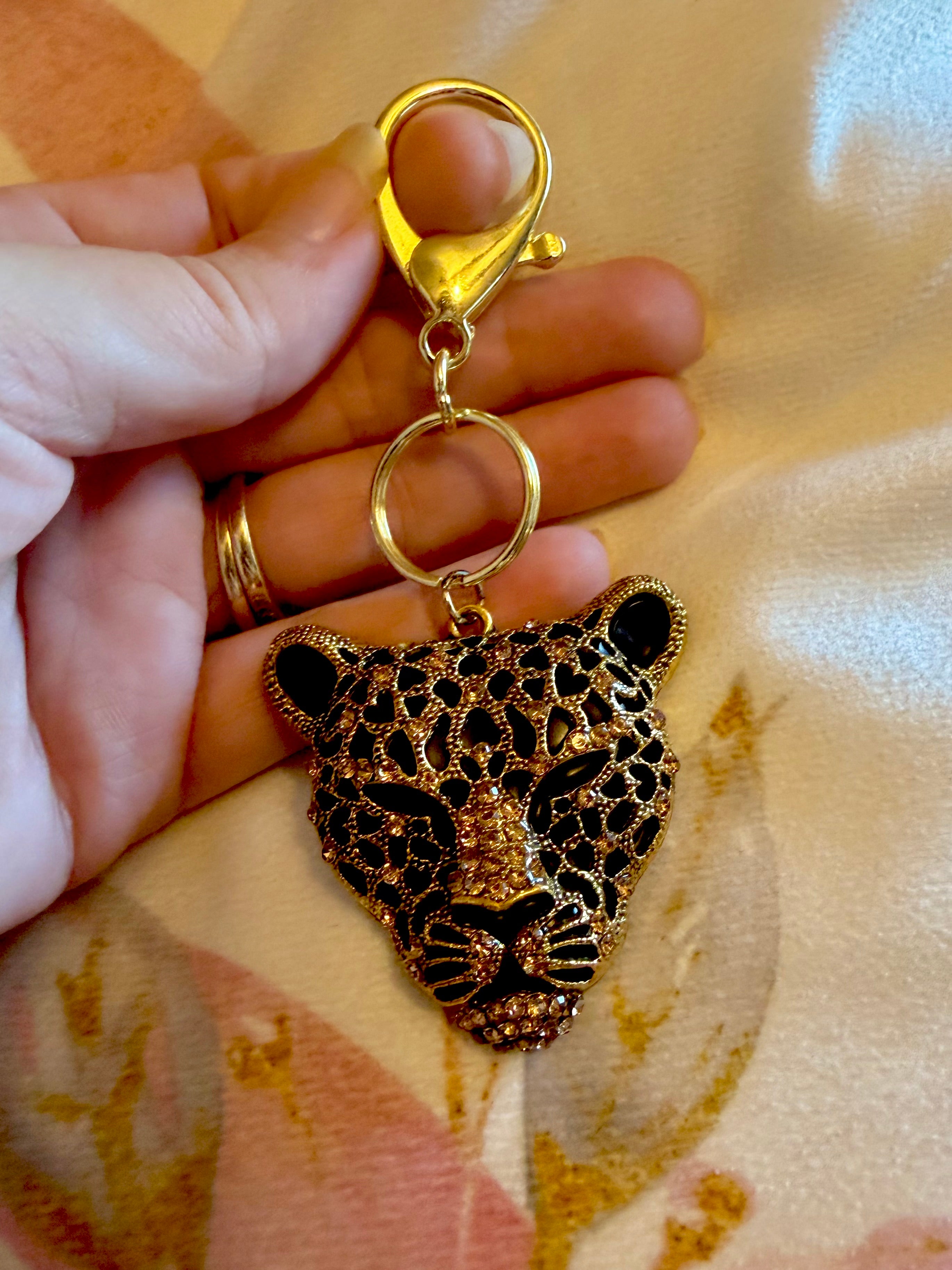 Gold tone Classy Cheetah Keychain with Rhinestone accents!
